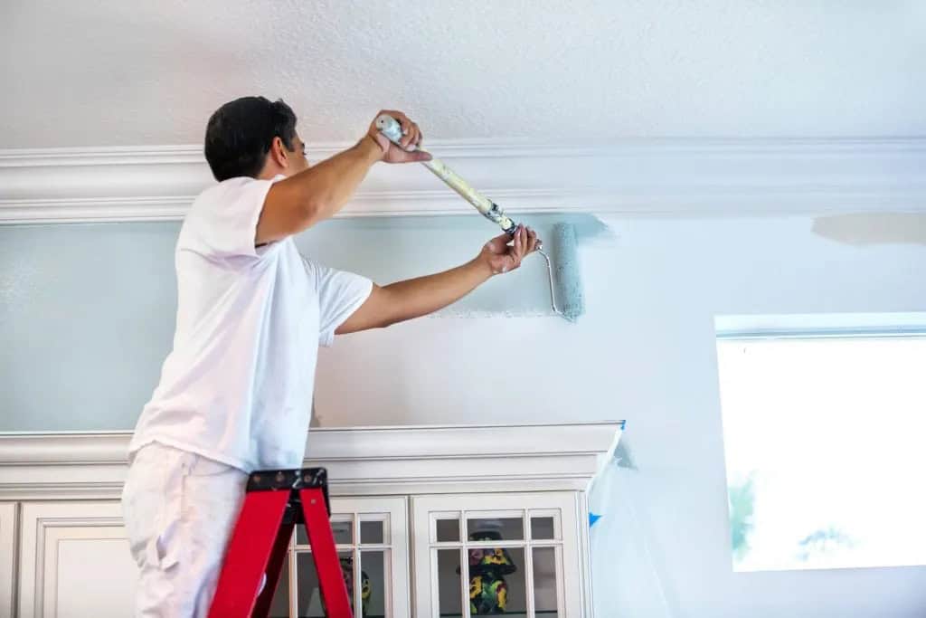 Professional painting contractor working on a home in Squirrel Hill Pittsburgh